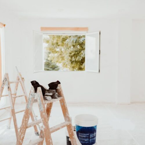 ladders-and-painter-tools-on-white-room-at-constru-2024-11-03-00-22-17-utc