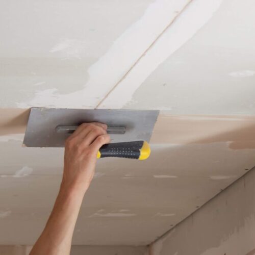 man-plastering-ceiling-repair-selective-focus-2025-03-16-03-48-23-utc man-plastering-ceiling-repair-selective-focus-2025-03-16-03-48-23-utc